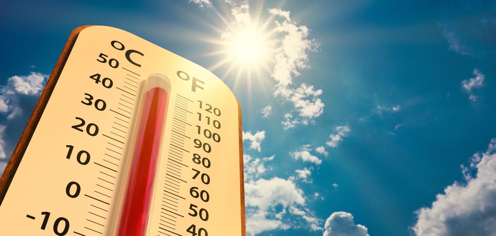Termometer mot blå himmel