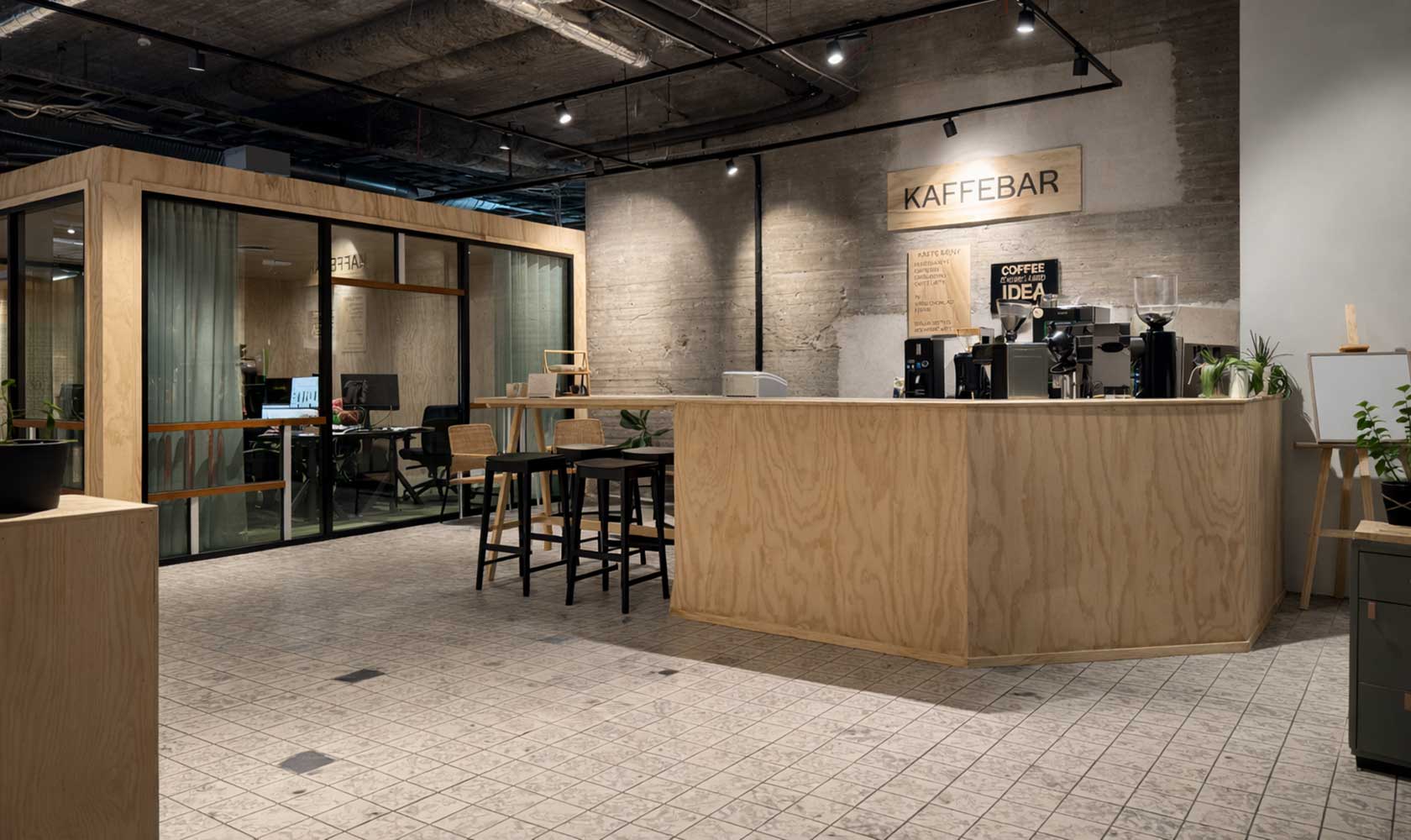 Modern kaffebar i kontorslobby med träbar, espressomaskin och sittplatser
